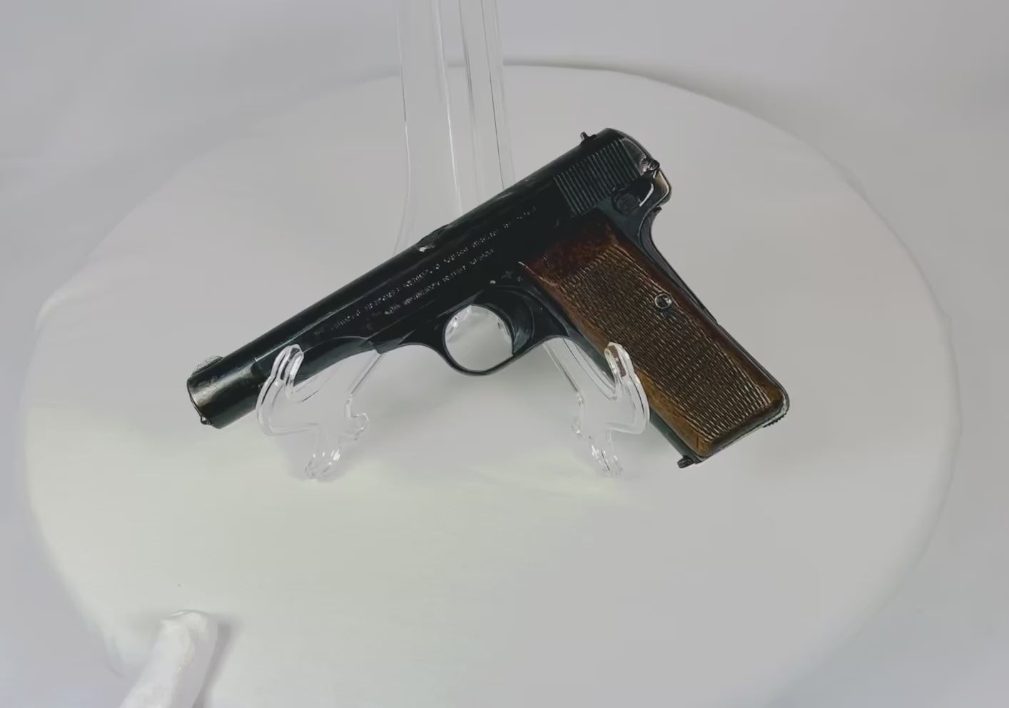 WWII-era FN Browning Model 1922 semi-automatic pistol, 7.65mm caliber, extended 114mm barrel, eight-round magazine, checkered walnut grips, German Nazi acceptance marks eagle/WaA140 and eagle/swastika, deactivated, produced 1941–1944 in Belgium
