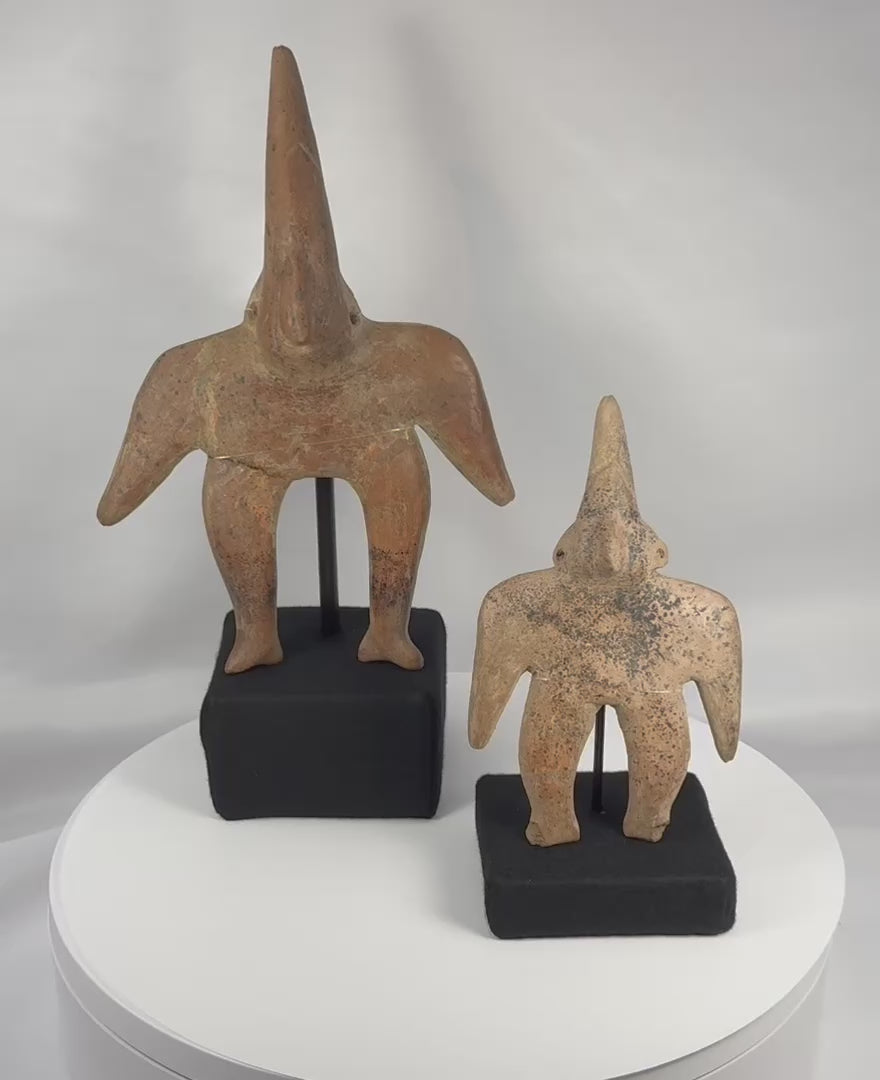 360-degree rotating view of two Ancient Pre-Columbian Colima Gingerbread terracotta figures from Western Mexico displaying archaeological surfaces, restoration, and custom museum mounts