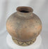 360-degree view of an antique Timorese earthenware storage vessel featuring hand-painted spiral motifs, a globular form, rich aged patina, and traditional Southeast Asian craftsmanship.