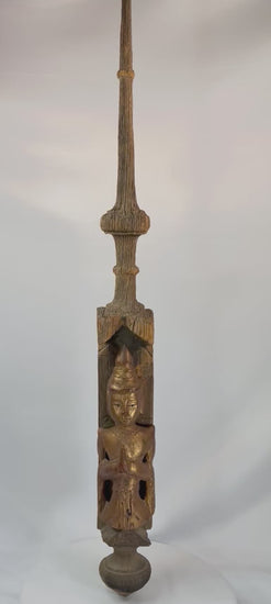 Monumental 45-inch Burmese temple finial, late 19th–early 20th century, carved hardwood with gilded Buddha in Anjali Mudra and spire form, retaining aged patina.