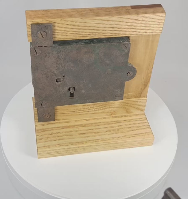 Demonstration of antique rim lock using original iron key showing engagement of internal locking mechanism
