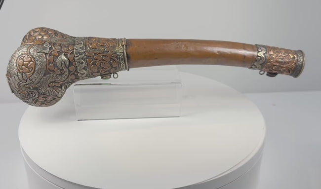 360-degree rotating video of a 19th–early 20th century Tibetan Kangling human femur ritual trumpet with dragon metal fittings and turquoise-coloured inlays