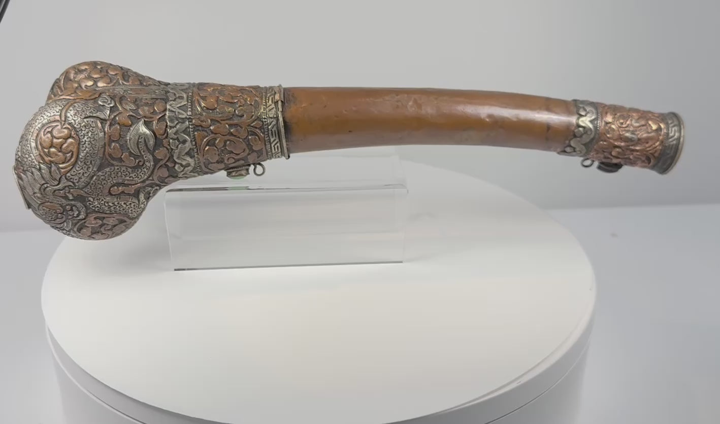 360-degree rotating video of a 19th–early 20th century Tibetan Kangling human femur ritual trumpet with dragon metal fittings and turquoise-coloured inlays