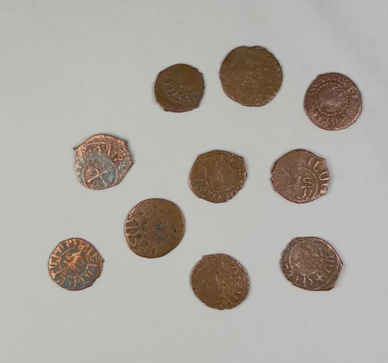 Rotating view of ten authentic Crusader States bronze coins with Christian symbols and Latin inscriptions, 11th–13th century AD.