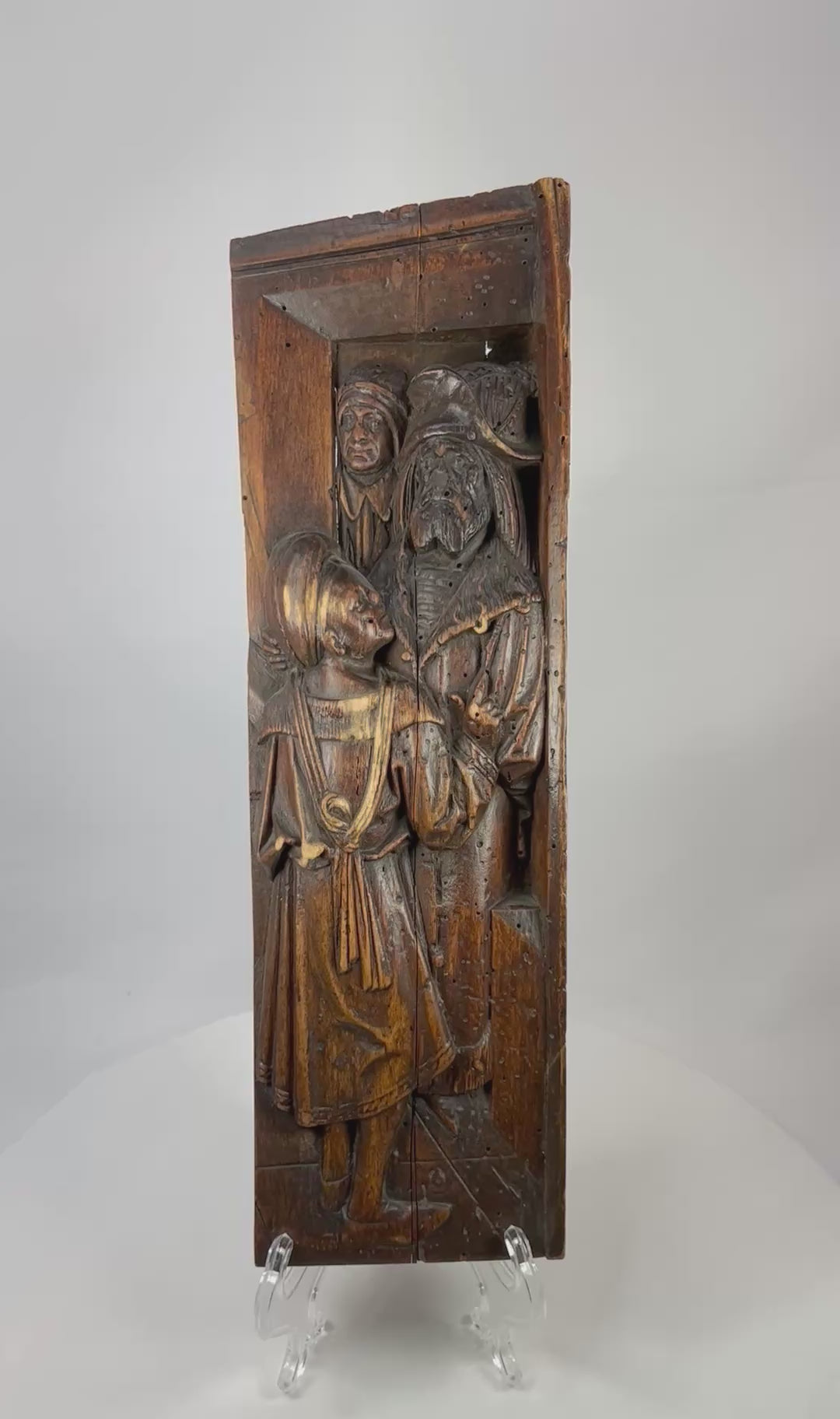 360° video of a 16th–17th century Gothic/Tudor carved oak relief panel showing robed figures in deep architectural niche.
