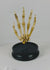 Video showing an early 20th-century articulated human skeletal hand mounted under a glass dome, highlighting bone structure, joints, and display base.