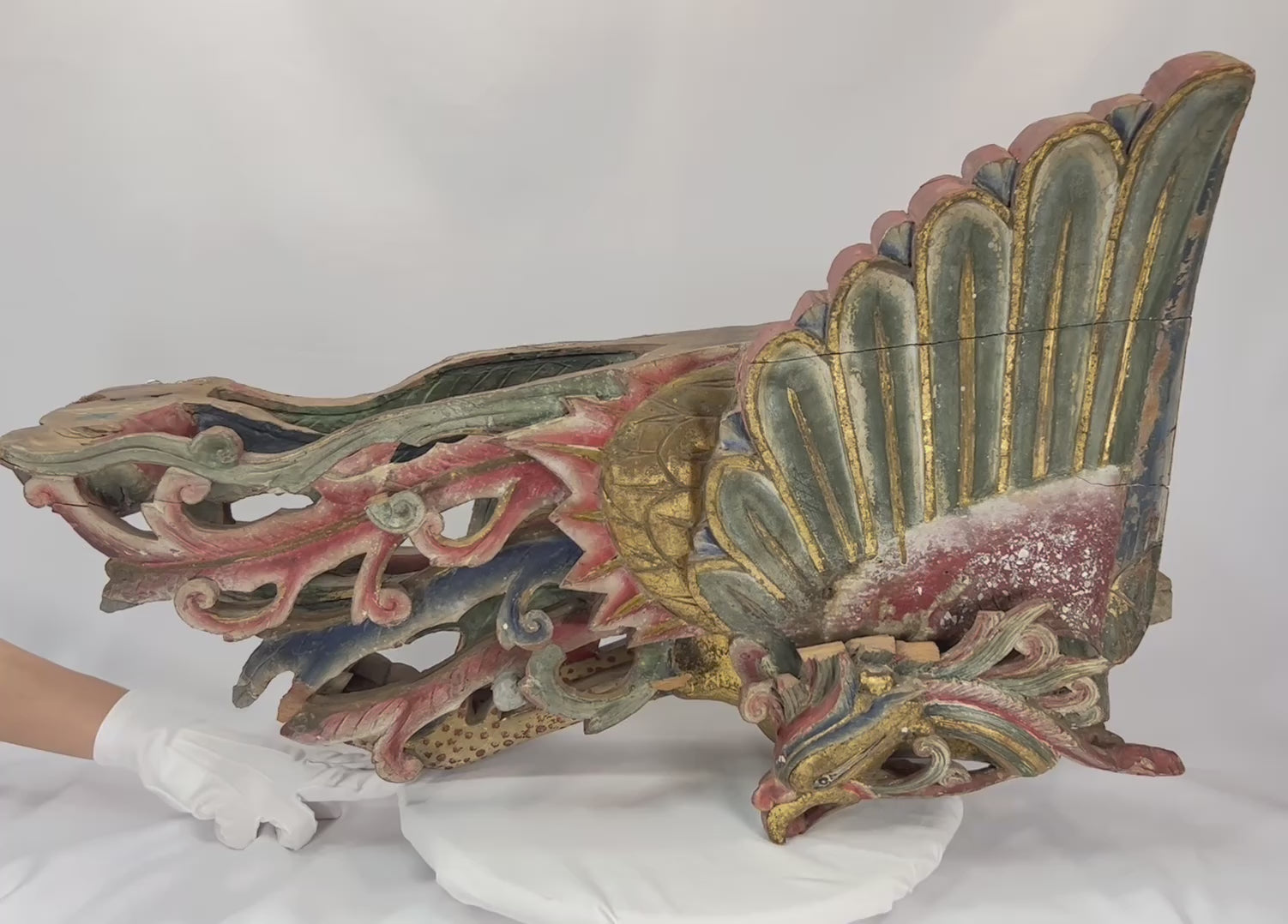 Mid-19th century Chinese carved camphor wood phoenix, detailed plumage with traces of polychrome paint and gilding, symbolizing immortality and prosperity.
