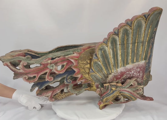 Mid-19th century Chinese carved camphor wood phoenix, detailed plumage with traces of polychrome paint and gilding, symbolizing immortality and prosperity.