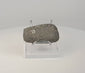 Rotating 360-degree view of a Pre-Columbian Andean ground stone axe from Ecuador or Peru, circa 200–800 CE, showing its worn cutting edge, beveled surfaces, aged patina, and archaeological markings.