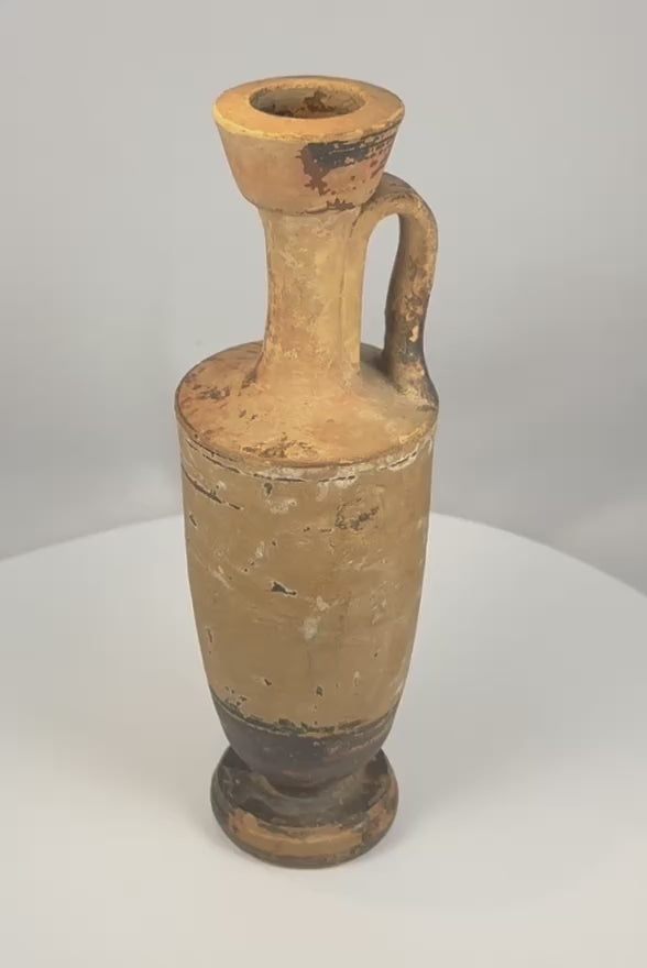 Rotating presentation of an ancient Greek terracotta lekythos with a narrow neck, strap handle, flared mouth, and surviving painted decoration.