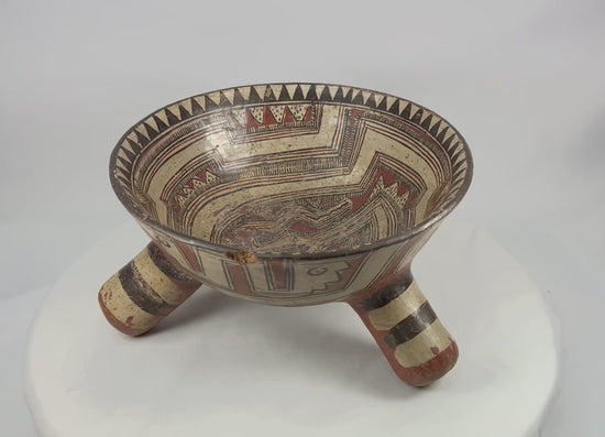 360° rotation video of Pre-Columbian Nicoya rattle tripod bowl demonstrating painted motifs, rattling tripod legs, and overall craftsmanship from all angles.