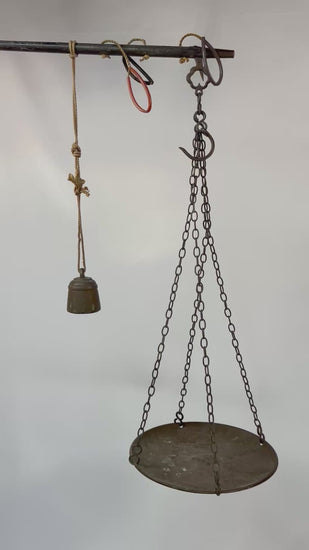 Antique Indian steelyard balance scale, circa 18th–19th century, with forged iron beam, engraved calibration notches, bronze hanging pan, and original cast bronze weight with woven cord. Traditional Mughal/Colonial trade tool with rich aged patina.