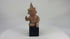 Video showing a West Mexican Nayarit seated terracotta figure with tall conical headdress and archaeological patina, ca. 100 BCE–300 CE