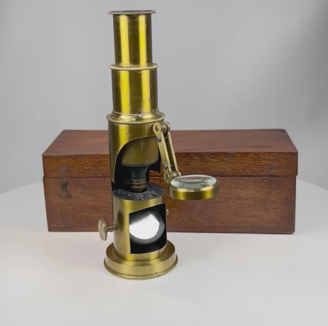 360 degree view of Victorian brass field microscope with mahogany case showing full instrument details and optical components