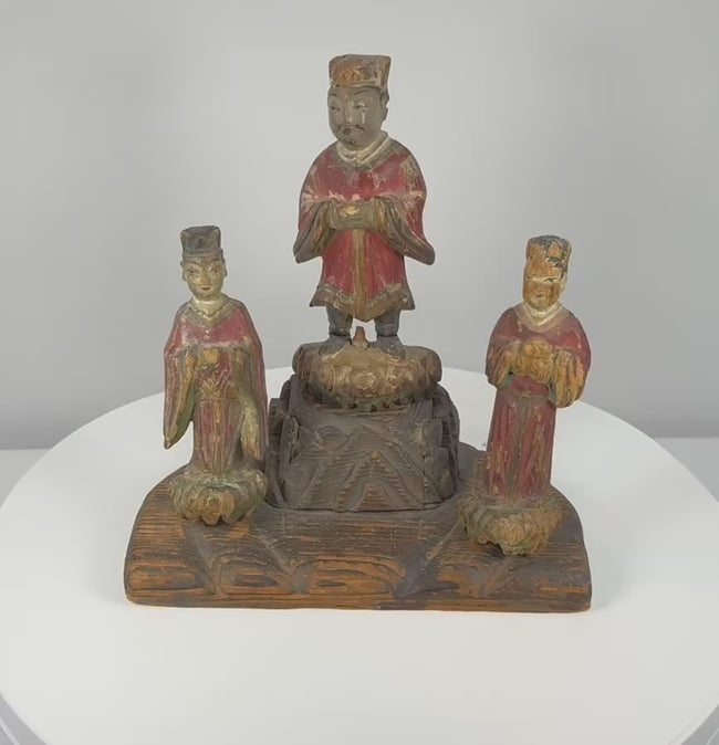 Video showing multiple views and painted details of a Late Qing Dynasty Chinese wooden shrine group with a central official and two attendants