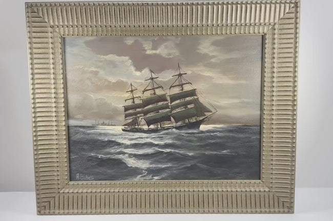 Video of Alfred Gabali’s “Ships That Pass in the Night,” circa 1958, a maritime oil painting depicting sailing ships at sea in an ornate gold-toned frame.