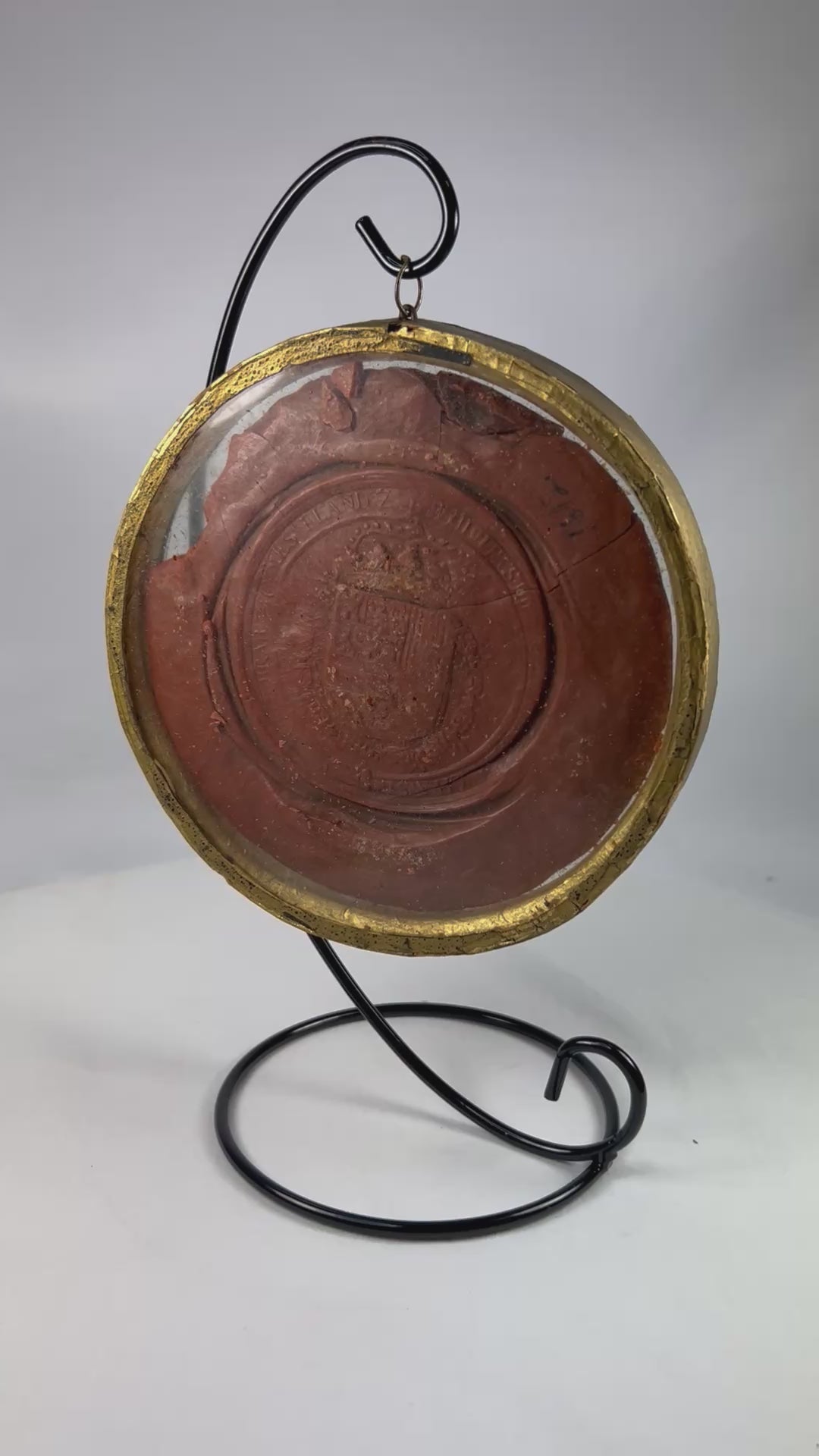 Red wax royal seal of King Philip IV of Spain, circular with detailed enthroned monarch design and Latin inscription, mounted on a white background.