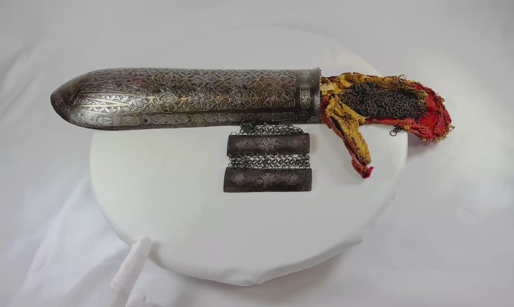 360-degree rotating view of an 18th-century Qajar Persian warrior’s Bazu-Band arm guard featuring engraved steel, gold koftgari decoration, and original chain-mail sections.