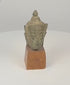 Thai bronze Buddha head with serene facial features, elongated earlobes, pointed ushnisha and naturally aged patina