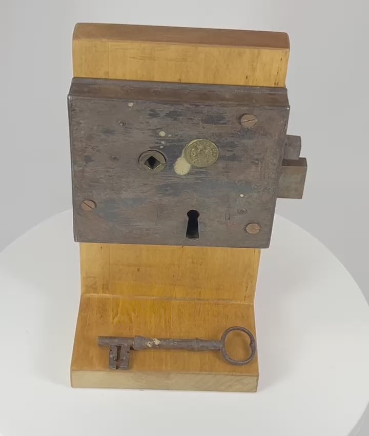 360° rotating view of a 19th century Carpenter and Co iron rim lock with original key and forged construction