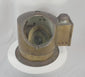 360-degree view of an antique brass maritime binnacle compass featuring a helmet-form body, glass viewing window, gimbaled liquid compass, and aged nautical patina