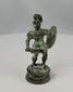 360° rotating view of an antique bronze classical warrior figure with helmet, shield, and aged green patina