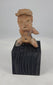 360-degree video of an ancient Pre-Columbian West Mexico seated terracotta figure showing expressive facial details, headdress, pierced ears, pigment remains, and archaeological patina