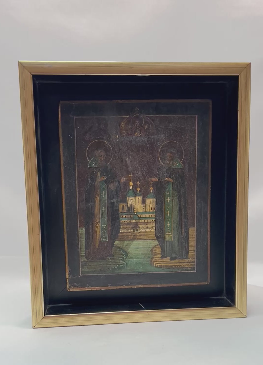 360-degree presentation of an antique Russian Orthodox icon depicting Saints Zosima and Savvaty with the Solovetsky Monastery, showing fine detailing, rich color tones, gilded highlights, and framed museum-style display
