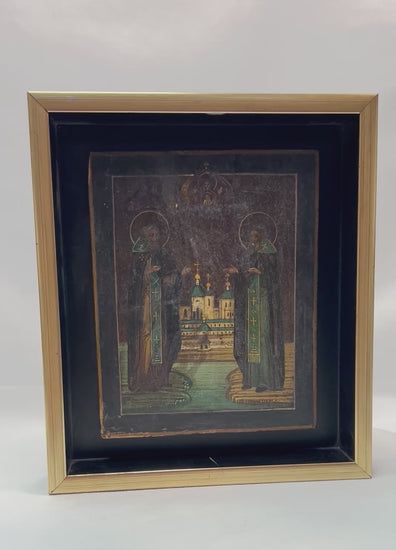 360-degree presentation of an antique Russian Orthodox icon depicting Saints Zosima and Savvaty with the Solovetsky Monastery, showing fine detailing, rich color tones, gilded highlights, and framed museum-style display