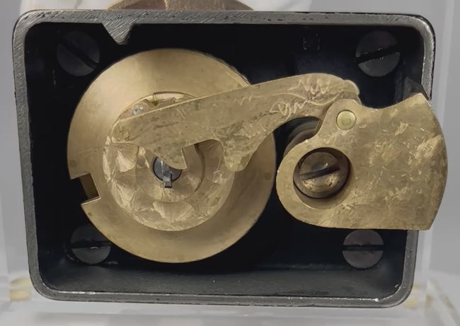 view of antique safe lock mechanism back showing internal components and locking system