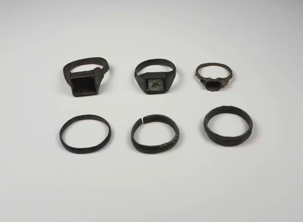 Video showing a group of six Late Roman to Early Byzantine bronze finger rings from multiple angles, circa 3rd–7th century CE