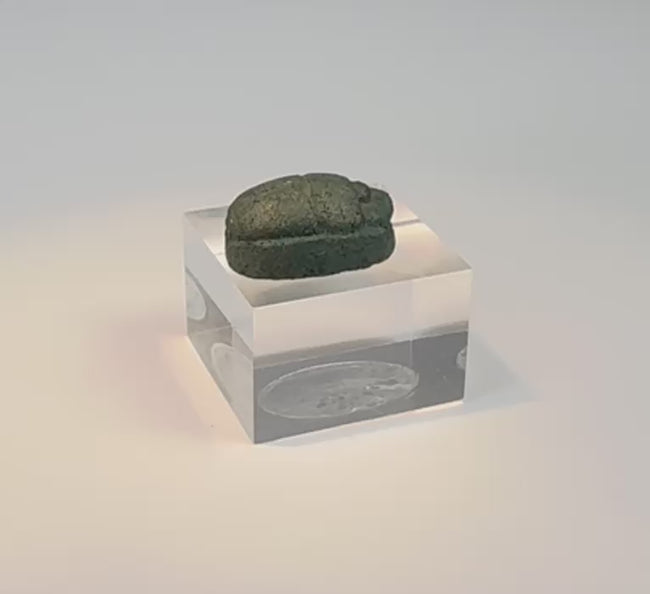 Rotating view of an ancient Egyptian blue-green glazed faience scarab amulet