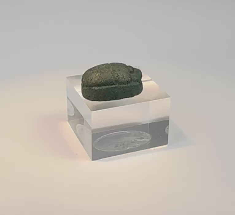 Rotating view of an ancient Egyptian blue-green glazed faience scarab amulet