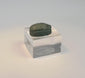 Rotating view of an ancient Egyptian blue-green glazed faience scarab amulet