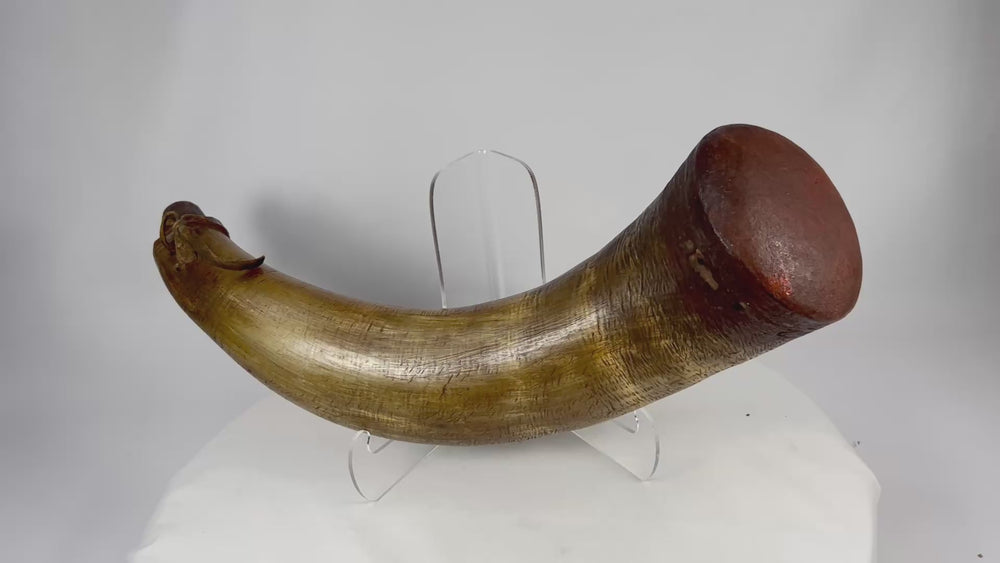 360-degree rotating view of an early firearms powder horn with leather thong and museum label