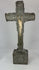 360° view of an antique hand-carved crucifix featuring a bone corpus on a repoussé-decorated wooden cross with aged patina, displayed under soft lighting on a white background.