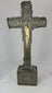 360° view of an antique hand-carved crucifix featuring a bone corpus on a repoussé-decorated wooden cross with aged patina, displayed under soft lighting on a white background.