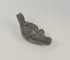 Rotating view of an antique grotesque satyr-form oil lamp featuring a cast metal mythological mask, filling aperture, wick nozzle, suspension holes, and dark aged patina, Europe, 19th century.