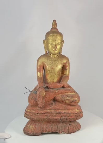 Large antique Burmese Shan-style Buddha statue with original gilt finish, seated in dhyana mudra on a tiered lotus base. 19th-century Southeast Asian devotional sculpture showing serene expression, aged surface, and traces of red lacquer beneath gold.
