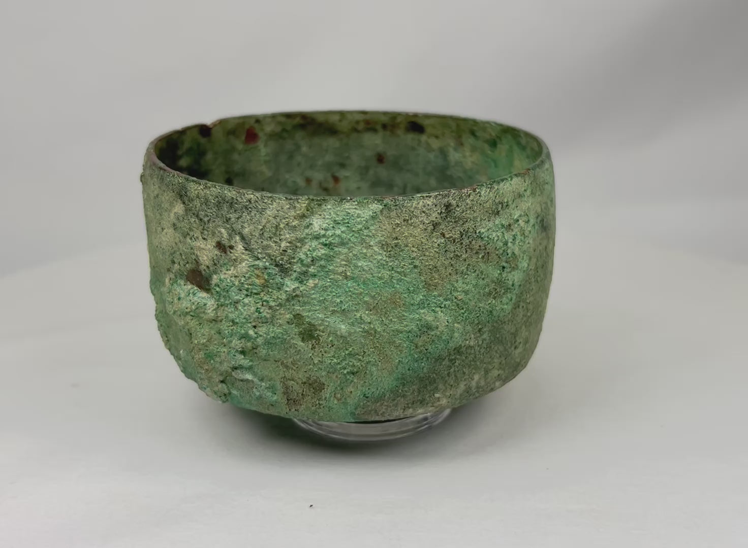 360-degree rotating view of an ancient Luristan bronze bowl, showcasing its rounded form, thin walls, and richly mineralized green and turquoise patina from the Early Iron Age.