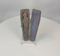 Video of an antique Alpine Tödlein memento mori miniature coffin containing a textile-wrapped figure with a carved skull