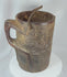 360-degree view of an antique Himalayan carved wooden storage vessel featuring geometric relief carving, an integrated side handle, original fiber rope suspension handle, and rich aged patina.