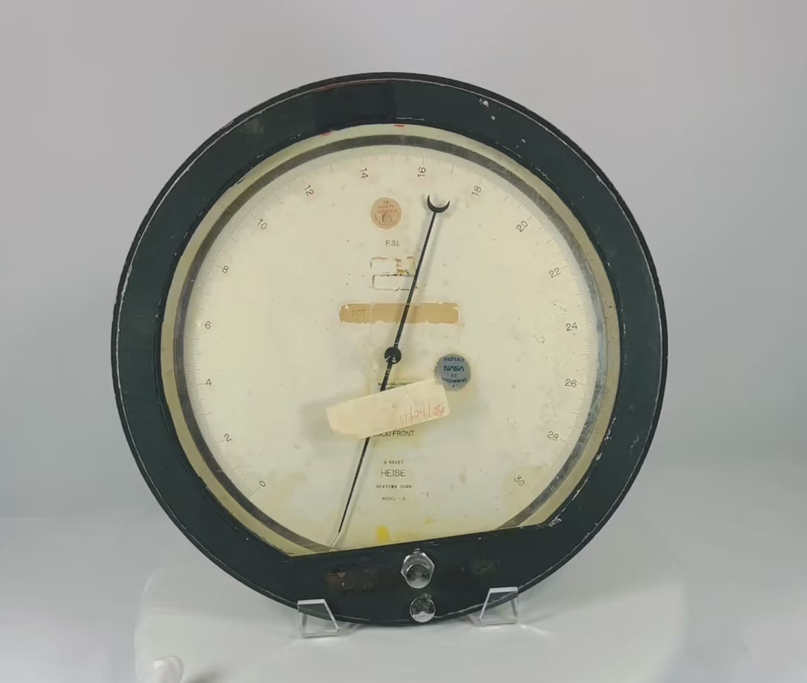 Authentic NASA low-pressure gauge from the Space Shuttle Program, mid-1980s. Manufactured by Heise in Newtown, Connecticut, marked “Property of NASA U.S. Government,” with original calibration and service stickers. Ground support equipment used for monitoring hydraulic, fuel, or environmental pressures during shuttle pre-launch operations.