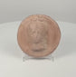 360-degree rotating view of a Hellenistic Greek terracotta female bust medallion, showing the high-relief portrait, elaborate coiffure, circular rim, weathered surface, and plain reverse.