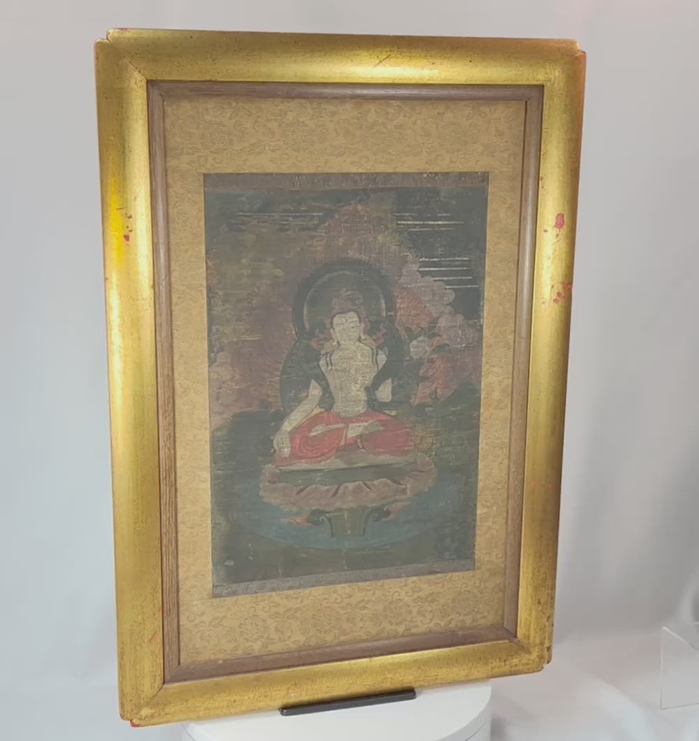 360° rotating view of Tibetan Buddhist silk painting with framed devotional figure and brocade mount