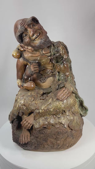 360-degree view of a Chinese glazed terracotta figure depicting the eccentric Buddhist monk Jigong with vine leaves, gourds, and earthy green and amber glazes.