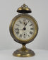 360-degree rotating view of an antique German JUF brass pedestal alarm clock, circa 1900–1920, featuring an ornate circular brass case, Roman numeral dial, subsidiary registers, domed alarm bell, decorative pedestal base, and rear mechanical winding controls.