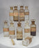 360-degree view of a 19th century mahogany apothecary box containing glass medicine bottles, handwritten prescriptions, and Victorian pharmacy labels.