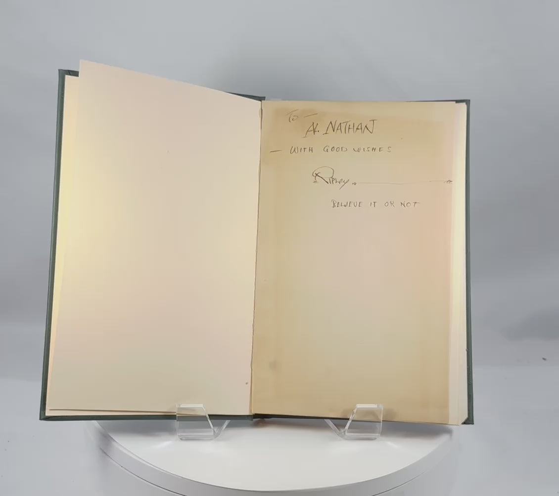 Video showing a signed 1929 first edition of Ripley’s Believe It or Not! featuring Robert Ripley’s handwritten inscription and signature, with views of the hardcover binding and interior pages.