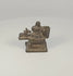 360-degree rotating view of a 19th century Indian brass Shiva Lingam and Nandi miniature devotional shrine, showing the stepped pedestal, recumbent Nandi bull, cylindrical fitting, and aged dark patina.